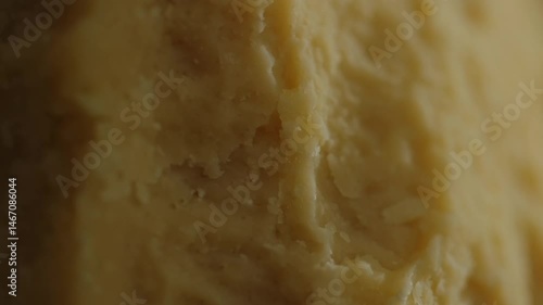 Many pieces of different types of craft cheeses close-up, assortment of cheeses with noble mold, parmesan, maasdam, camembert, stilton. Cheese textures and delicacies close-up, cheese manufactory.