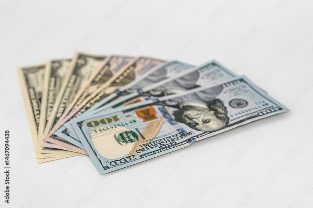 A lot of money one hundred dollar bills on a white background. A lot of money one hundred dollar bills on a white background.