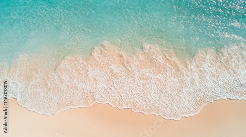 Stunning Aerial View of Turquoise Ocean Waves Gently Crashing on a Sandy Beach