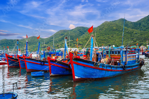 Wallpaper Mural Traditional Vietnamese fishing boats, ships and vessels at Nha Trang Seaside Fishing Seaport Torontodigital.ca