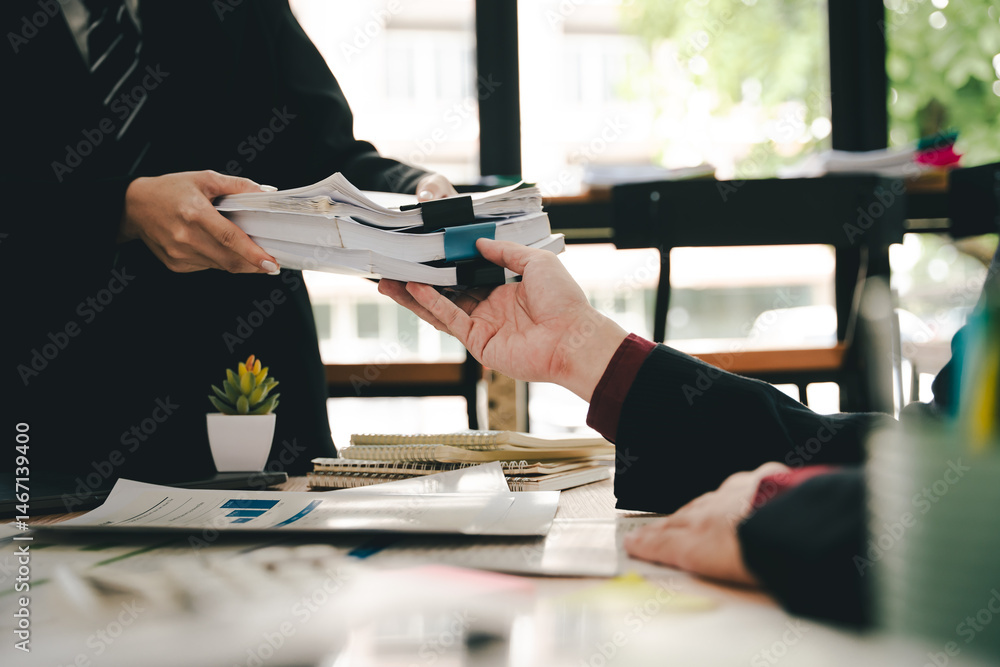 Employees working with a lot of documents, searching for documents, accounting for income and expenses, recording taxes, and working hard. Employees working with a lot of documents, searching for documents, accounting for income and expenses, recording taxes, and working hard.
