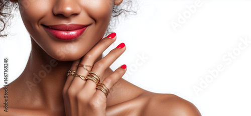 Luxury makeup, manicure, and jewelry in a feminine close-up. Close-up of a woman with red lips, polished nails, and elegant rings, ideal for beauty, fashion, and luxury campaigns.