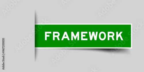 Green color square shape sticker label with word framework inserted in gray background