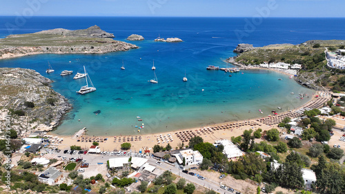 Obraz na płótnie Aerial drone photo of stunning turquoise sandy organized beach of Lindos town, Rhodes island, Dodecanese, Greece w salonie