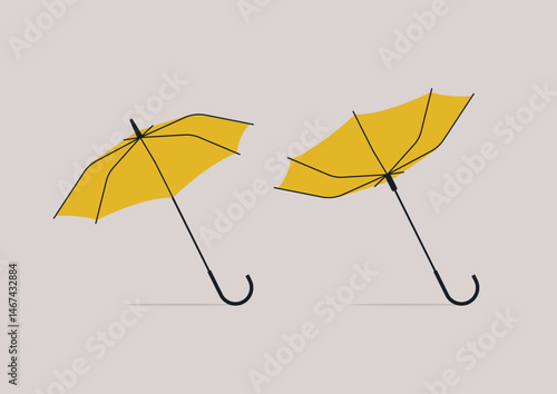 Two bright yellow umbrellas pop against a soft backdrop—one open and steady, the other flipped inside out by a sudden gust, capturing the chaos and charm of city life in the rain