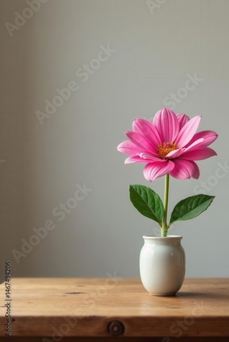 Wallpaper Mural One pink flower sits atop a simple wooden table, bloom, blossom Torontodigital.ca
