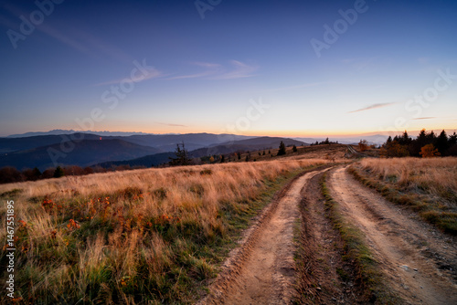 Fototapeta Naklejka Na Ścianę i Meble -  Picturesque meadow Stumorgowa, Beskidy, Poland. Path on the meadow in autumn.