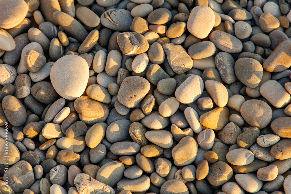 A pile of rocks with a sun shining on them A pile of rocks with a sun shining on them