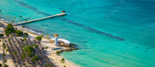 Bayahibe beach aerial photo by drone. Caribbean sea with beautiful beach, lighthouse and romantic pier.Dominican Republic.