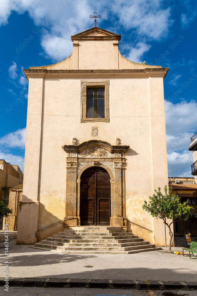 Fototapeta premium Church facade with stairs and cross in Niscemi