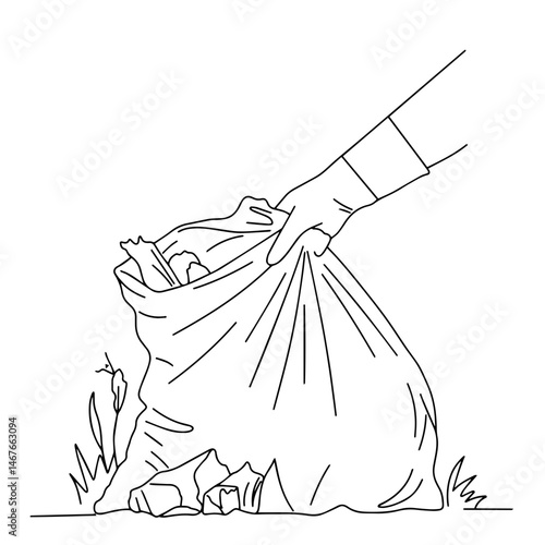 Person collecting trash in a bag in a natural setting  
