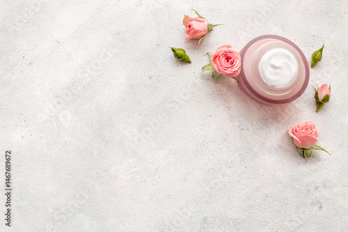 Fényképezés Skin care cosmetic crem with pink roses flowers, top view