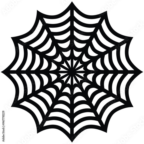 A symmetrical black spiderweb forms a distinct pattern against a bright white backdrop