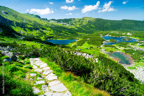 Fototapeta Naklejka Na Ścianę i Meble -  View from the mountain trail to the ponds in the Tatras. Picturesque landscape of mountain lakes in Poland.