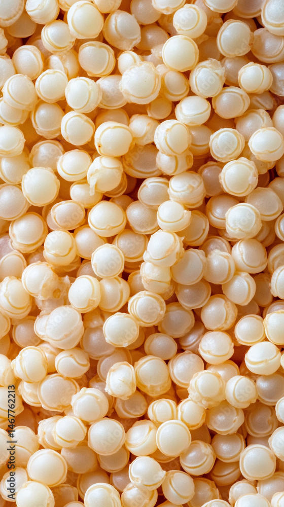 Close-up of raw white quinoa seeds showing detailed texture and natural pattern. Symbolizes health, nutrition, and organic simplicity in a wholesome superfood background for culinary or wellness theme