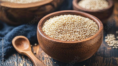 Obraz na płótnie Close-up of raw white quinoa seeds showing detailed texture and natural pattern. Symbolizes health, nutrition, and organic simplicity in a wholesome superfood background for culinary or wellness theme w salonie