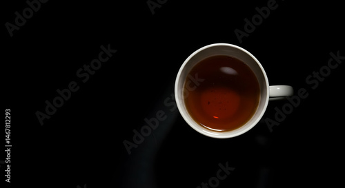 Aerial View of Warm Tea in a White Mug on a Dark Background