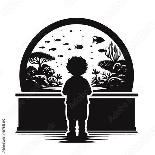 Child watching fish in aquarium
