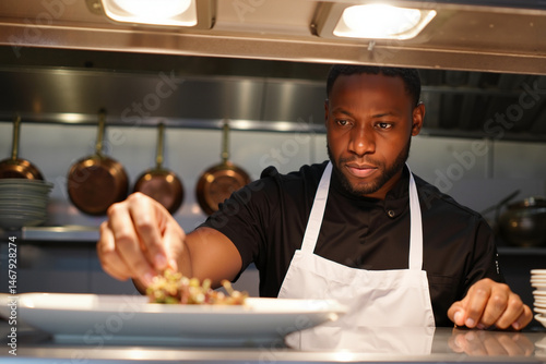 Male chef cooking in professional kitchen
