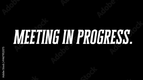 Meeting In Progress Sign 4k Animated Video on Black Background
