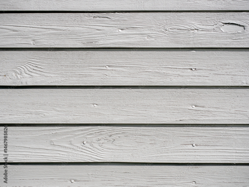 Obraz premium Close-up of gray painted wooden board texture, showcasing smooth surface and grain.