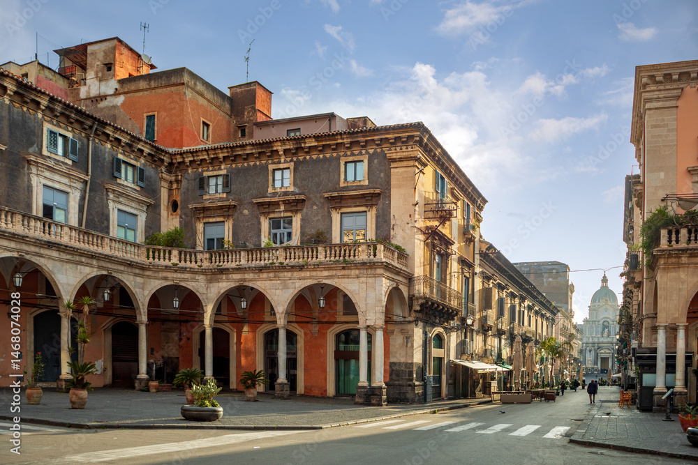 Naklejka premium View of Piazza Mazzini and Via Giuseppe Garibaldi ending at the Cathedral Basilica of Saint Agatha in Catania, Sicily, Italy