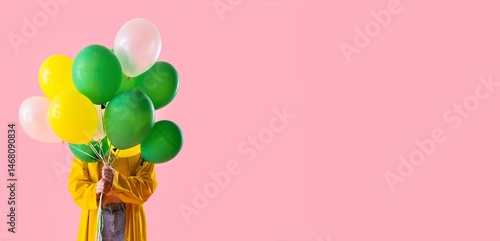 Young woman in raincoat hid...