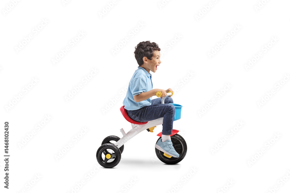 Kid riding a tricycle Kid riding a tricycle