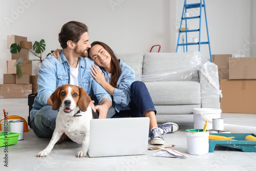 Young couple with Beagle do...