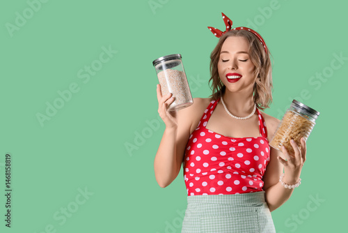 Young pin-up housewife with...