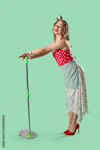 Young pin-up housewife with...