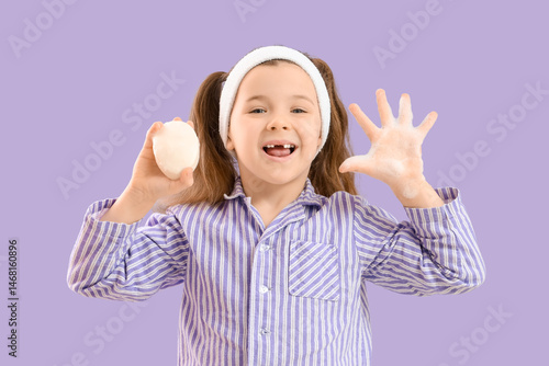Little girl in pajamas with...