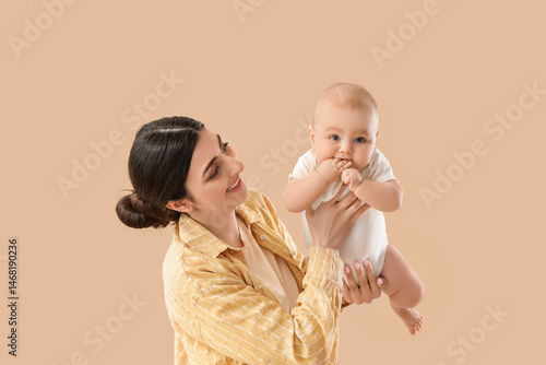 Happy mother holding adorab...