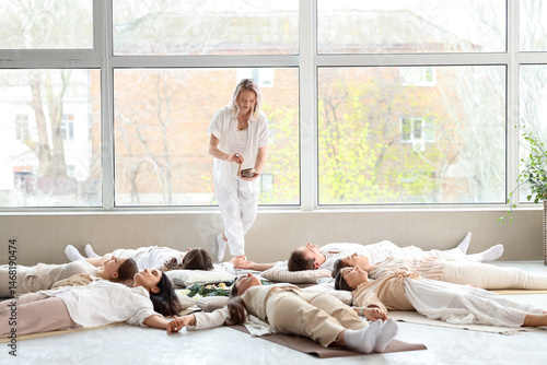 Group of people meditating ...