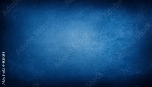 an elegant rich blue parchment texture grunge background with shadowed border and glowing center