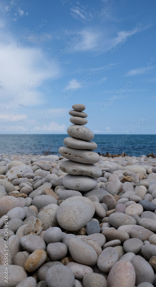 Fototapeta premium Pyramid of sea pebbles. Life balance and harmony concept.