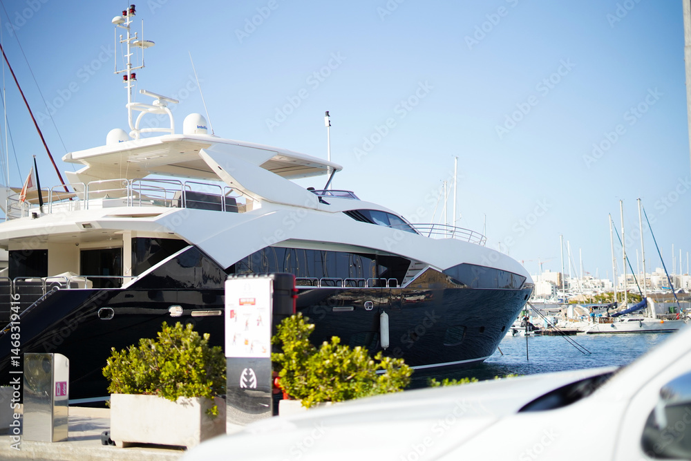 Naklejka premium Large white luxury yacht by the sea in marina, Ta' Xbiex Marina, Malta