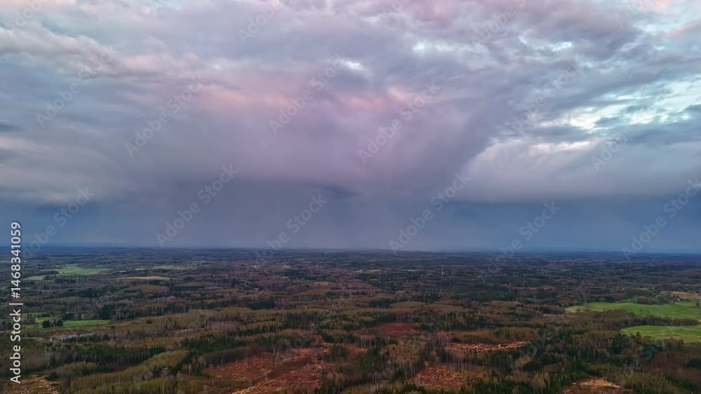 Crane up drone shot of forest, landscape and skyscape with clouds during the day, outdoor Crane up drone shot of forest, landscape and skyscape with clouds during the day, outdoor