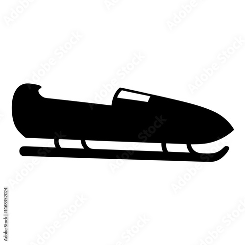 A sleek black bobsled in silhouette ready for winter racing action