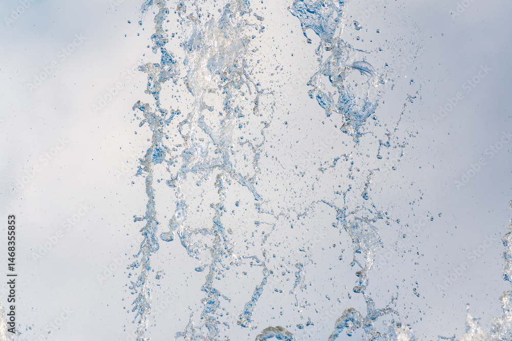 Splashes and jets of water against light background. Splashes and jets of water against light background.