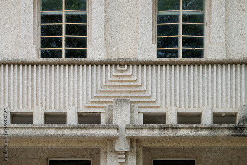 Canvas Print A symmetrical Art Deco style building facade with clean geometric lines, repetit