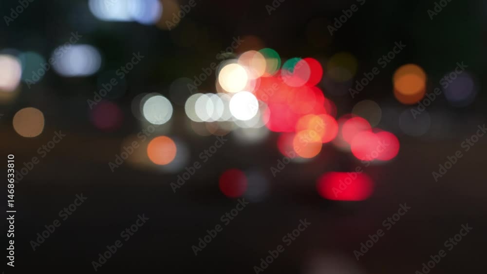 Defocused Traffic lights on the street. Blurred bokeh traffic in the city.