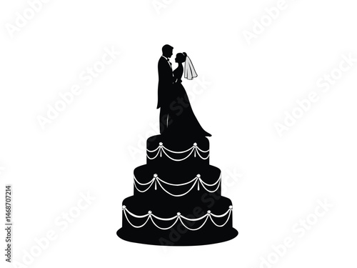 silhouette of wedding anniversary cake with bride and groom statues
