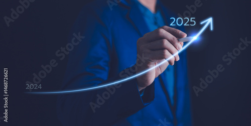 Obraz na płótnie 2025 Business development to success and growing growth concept, 2024 to 2025 growth. Businessman pointing arrow graph corporate future growth plan. w salonie