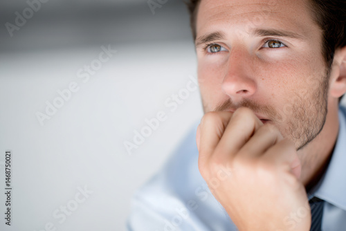 portrait of technician on left side of frame displaying thoughtful expression