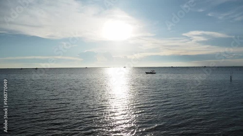 Timelapse of beautiful clouds over the sea, evening sunset light.
