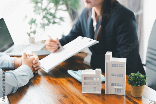 Real estate agent delivering sample home to customer, mortgage loan contract. Contract for hire purchase sale of house. home insurance contract, home mortgage loan concept. real estate, customer