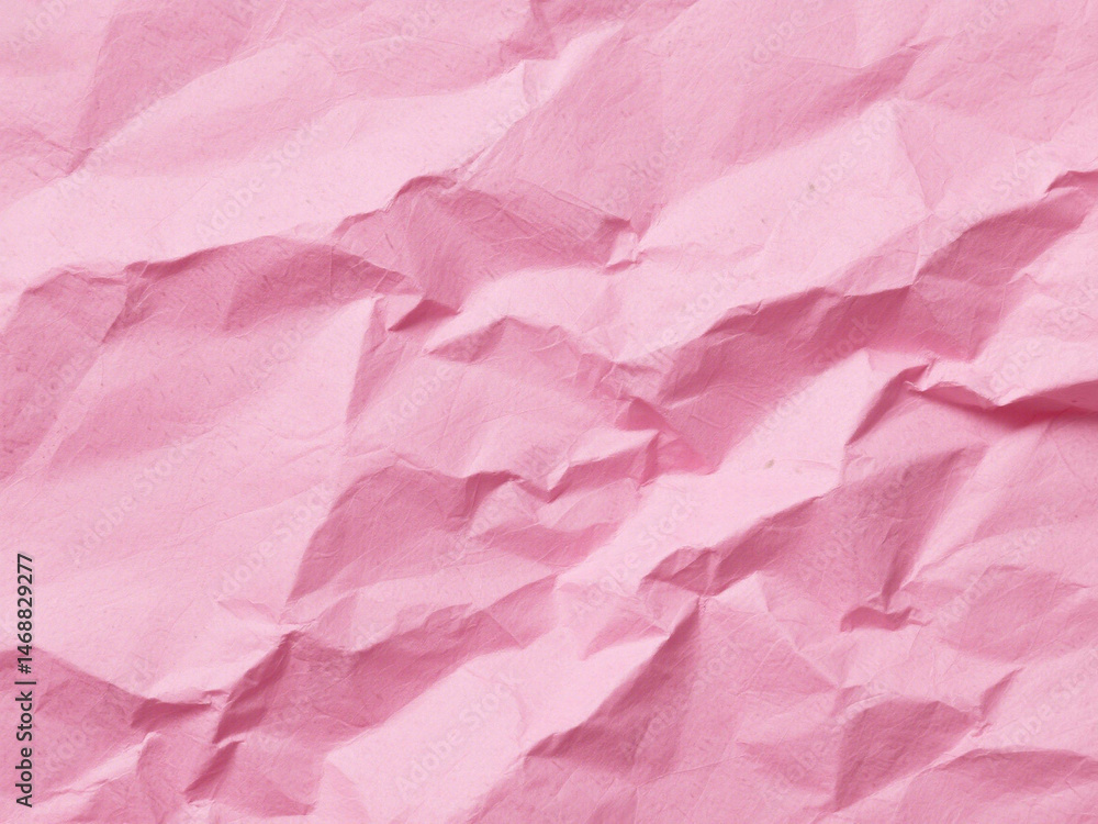 Fototapeta premium Crumpled pink paper texture. Pink wallpaper background 