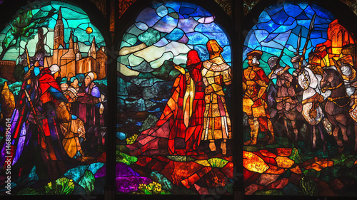 Colorful stained glass depicting historical figures and landscape