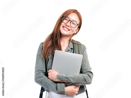 Smiling Asian woman wearing glasses holding a laptop and backpack, standing confidently and cheerfully on white background, isolated portrait of a happy female student or young professional